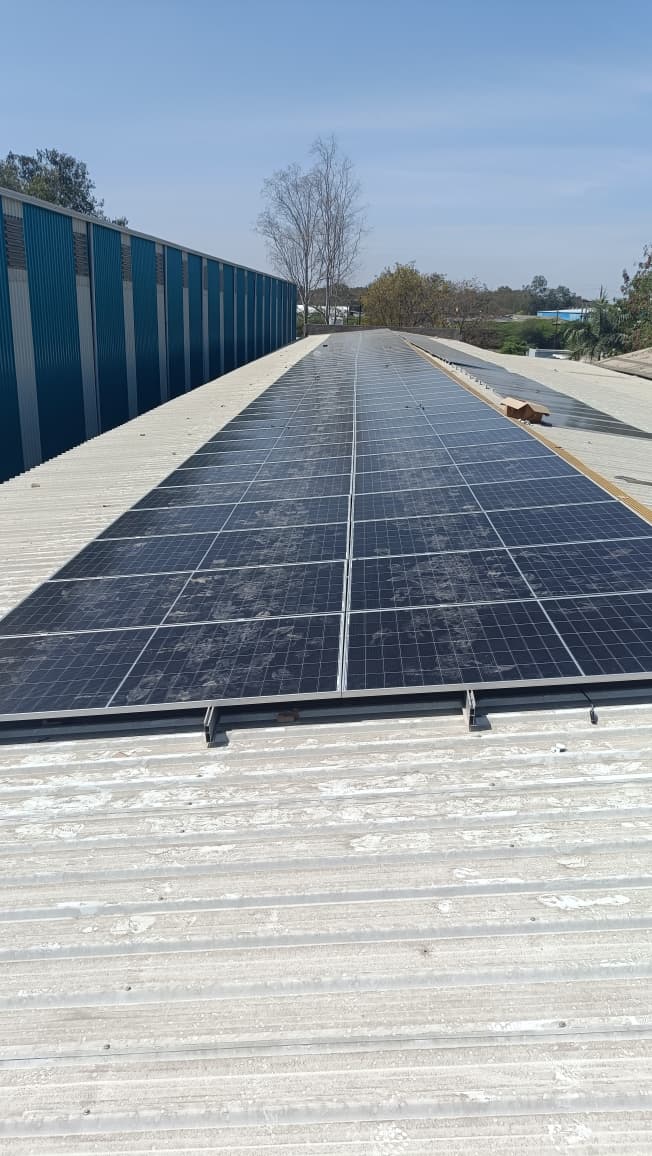 Modern luxury villa with infinity pool overlooking ocean, floor-to-ceiling windows, and contemporary architecture